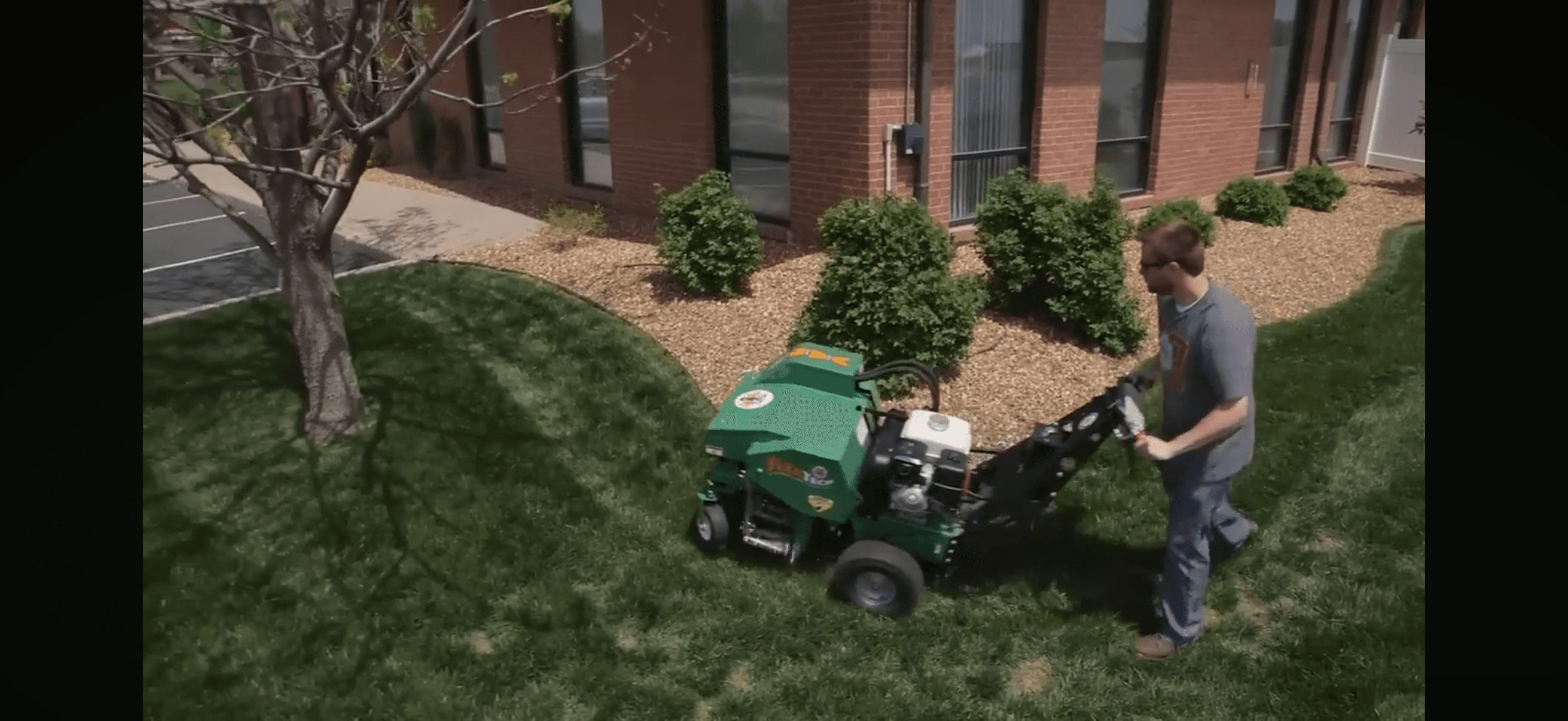 ProGrow Co. core lawn aeration in progress on a residential lawn in the Mobile, Alabama area